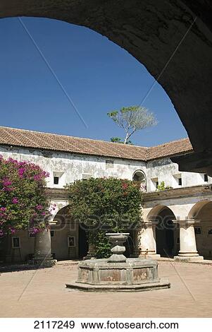 Stock Photo - Guatemala, Antigua, the ruined convent of Las Capuchinas, the courtyard. Fotosearch