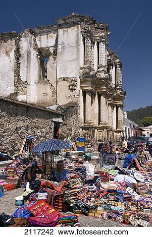 Stock Image - Guatemala, Antigua, the ruins of the Hermitage of El Carmen, local market in front of El Carmen. Fotosearch