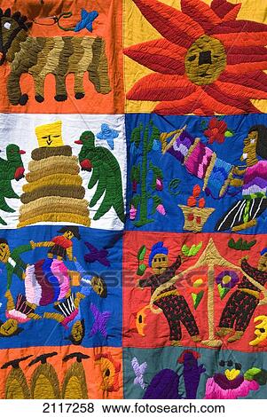 Stock Photo - Guatemala, Lake Atitlan, Panajachel, hand made fabrics for sale in the market. Fotosearch
