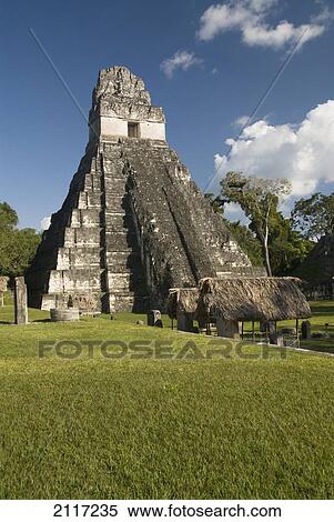 Stock Photography - Guatemala, Peten, Tikal National Park, Jaguar Temple at the great plaza.. Fotosearch