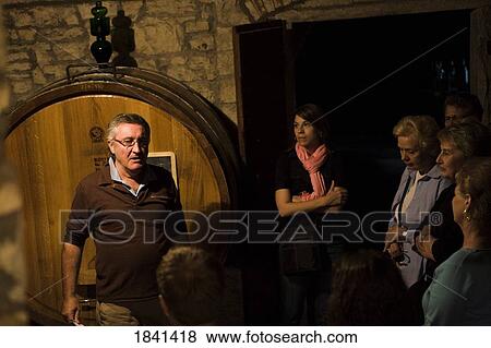 Stock Photo - Guide And Tourists In Wine Cellar; Castello Di Verrazzano, Greti, Italy. Fotosearch