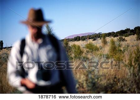 Stock Photograph - Guide Leading Bush Walk In The Outback. Fotosearch