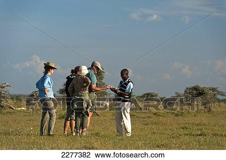 Guide showing people jaw bone of animal on walking safari, Ol Pejeta Conservancy; Kenya View Large Photo Image Stock Image - Guide showing people jaw bone of animal on walking safari, Ol Pejeta Conservancy; Kenya. Fotosearch