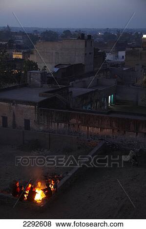 Stock Photo - Guides around camp fire at Castle Mandawa Hotel Mandawa Rajasthan India. Fotosearch
