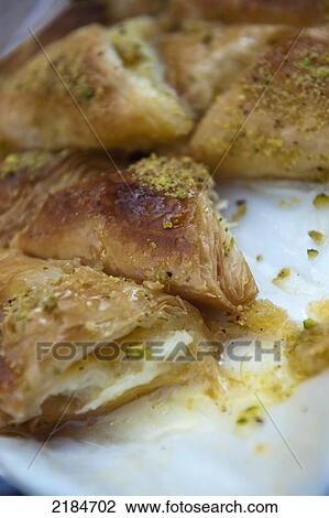 Habibah Arabic Sweet Shop That Makes A Popular Dessert Called Kunafeh, Amman, Jordan, Middle East View Large Photo Image Stock Image - Habibah Arabic Sweet Shop That Makes A Popular Dessert Called Kunafeh, Amman, Jordan, Middle East. Fotosearch
