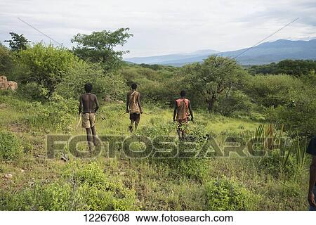 Stock Photo - Hadzabe people hunting; Tanzania. Fotosearch