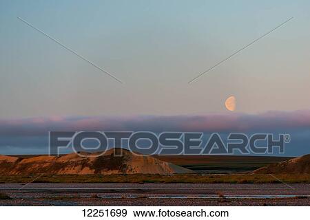 Stock Photo - Half moon over Bluff bank; Dead Horse, Alaska, United States of America. Fotosearch