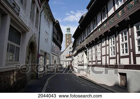 Stock Image - Half-Timbered Houses On Bergstrasse And Church Of Saints Cosmas And Damian, Goslar, Germany. Fotosearch
