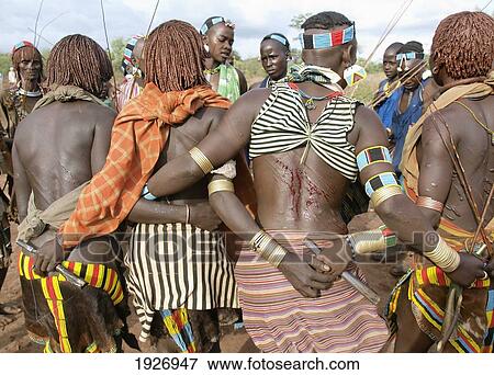 Hamar women showing off their scars after whipping, Omo Valley, Ethiopia View Large Photo Image Stock Photo - Hamar women showing off their scars after whipping, Omo Valley, Ethiopia. Fotosearch