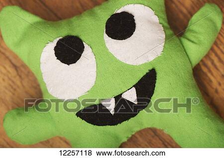Stock Photo - Hand-made stuffed monster doll. Fotosearch