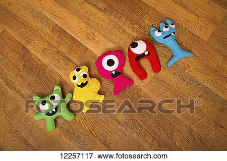 Stock Photo - Hand-made stuffed monster dolls. Fotosearch
