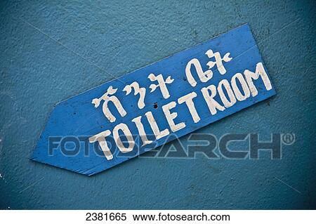 Stock Photography - Hand painted sign for the toilet room; Ethiopia. Fotosearch