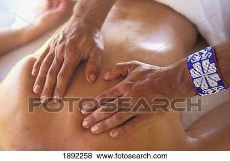 Hands Massaging Womans Back At Spa View Large Photo Image Stock Photo - Hands Massaging Womans Back At Spa. Fotosearch