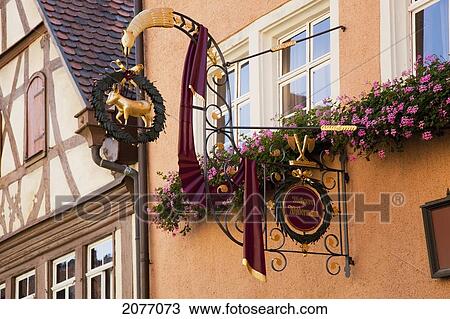 Stock Image - Hanging Sign At The Butcher Shop; Rothenburg Ob Der Tauber Bavaria Germany. Fotosearch