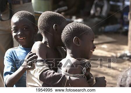 Stock Photography - Happy young boys smiling together in Bamako, Mali. Fotosearch