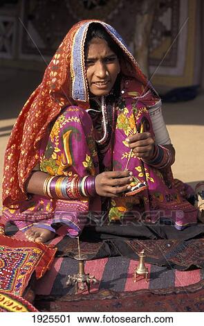 Harijan Girl Dressed In Colourful Sari Selling Trinkets, Ludia Village, North Of Bhuj View Large Photo Image Stock Image - Harijan Girl Dressed In Colourful Sari Selling Trinkets, Ludia Village, North Of Bhuj. Fotosearch