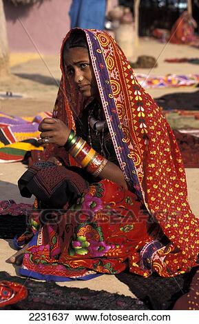 Stock Photo - Harijan Woman Dressed In Colorful Sari Selling Textiles, Ludia, Gujarat, India. Fotosearch