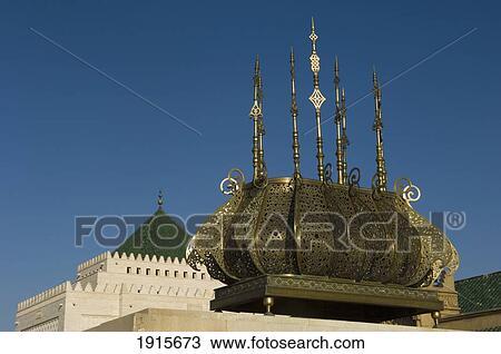 Stock Image - Hassan Tower With Copper Candelabras. Fotosearch
