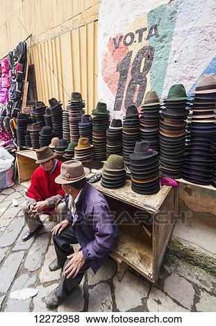 Stock Photo - Hat vendor at the Thursday market, Guamote, Chimborazo, Ecuador. Fotosearch