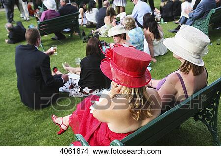 Hats and fashionable clothes at new Grandstand Enclosure during Royal Ascot horse racing meeting; Berkshire, England View Large Photo Image Picture - Hats and fashionable clothes at new Grandstand Enclosure during Royal Ascot horse racing meeting; Berkshire, England. Fotosearch