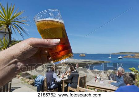 Stock Image - Having A Pint Of Real Ale At The Turks Head, Britain's Most South Westerly Pub, St Agnes, Isles Of Scilly, Cornwall, Uk, Europe. Fotosearch