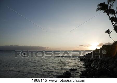 Stock Photography - Hawai, Maui, Lahaina, Stand-Up Paddler At Sunset.. Fotosearch