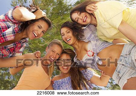 Stock Photo - Hawaii, A group of young women at the beach.. Fotosearch