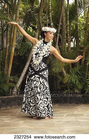 Hawaii, A Local Hawaiian Woman Wearing A Lei And A Hawaiian Print Dress. View Large Photo Image Picture - Hawaii, A Local Hawaiian Woman Wearing A Lei And A Hawaiian Print Dress.. Fotosearch