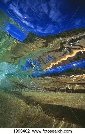 Stock Image - Hawaii, Abstract Underwater View Of Breaking Wave. Fotosearch