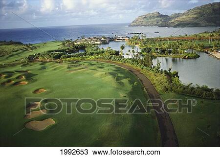 Stock Image - Hawaii, Aerial Of Kauai Lagoons Golf Corse Along Side Lagoon, Greenery. Fotosearch