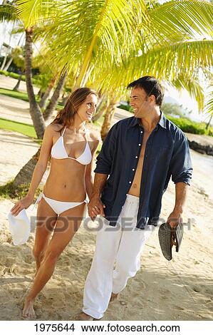 Hawaii, Attractive Couple Walking On Sunny Beach. View Large Photo Image Picture - Hawaii, Attractive Couple Walking On Sunny Beach.. Fotosearch