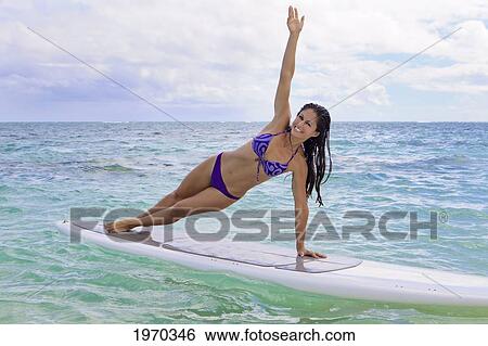Hawaii, Beautiful Brunette Girl Doing Yoga On Her Stand Up Paddle Board View Large Photo Image Stock Photograph - Hawaii, Beautiful Brunette Girl Doing Yoga On Her Stand Up Paddle Board. Fotosearch