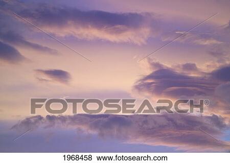 Stock Photo - Hawaii, Beautiful Cloud Formation At Sunset.. Fotosearch