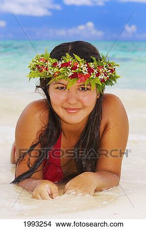 Picture - Hawaii, Beautiful Hawaiian Girl Wearing Haku Laying On Tropical Beach. Fotosearch