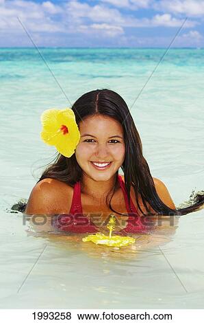 Hawaii, Beautiful Hawaiian Girl With Hibiscus In Ocean, Head And Shoulders Above Water View Large Photo Image Stock Photo - Hawaii, Beautiful Hawaiian Girl With Hibiscus In Ocean, Head And Shoulders Above Water. Fotosearch