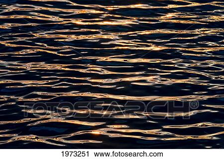 Stock Image - Hawaii, Big Island, Abstract View Of Colorful Reflections On Calm Water.. Fotosearch