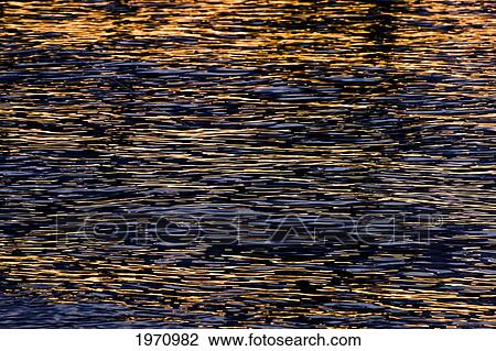 Stock Image - Hawaii, Big Island, Anaehoomalu Bay, Sunset Light Reflecting Off Kohala Coast.. Fotosearch