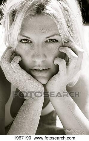 Stock Image - Hawaii, Big Island, Beautiful Blond Woman Covered In Sand, Black And White.. Fotosearch