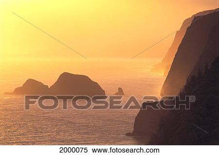 Stock Photography - Hawaii, Big Island, Coast At Sunrise From Pololu Valley Lookout, Hazy Orange C1611. Fotosearch