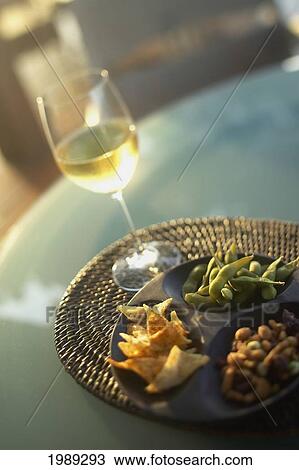 Hawaii, Big Island, Four Seasons Hualalai, White Wine In Glass And Pupus On Table. View Large Photo Image Stock Image - Hawaii, Big Island, Four Seasons Hualalai, White Wine In Glass And Pupus On Table.. Fotosearch