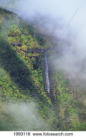 Stock Photo - Hawaii, Big Island, Hamakua Ditch Trail, Waterfall Along Mountainside. Fotosearch