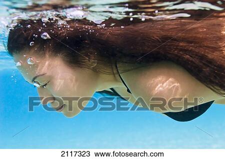 Hawaii, Big Island, Hapuna Bay, Young brunette woman swimming underwater. View Large Photo Image Stock Image - Hawaii, Big Island, Hapuna Bay, Young brunette woman swimming underwater.. Fotosearch