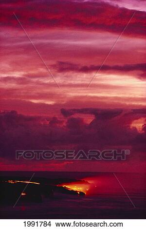 Picture - Hawaii, Big Island, Hawaii Volcanoes National Park, Lava Flows Into Ocean, Bright Red Sunset.. Fotosearch