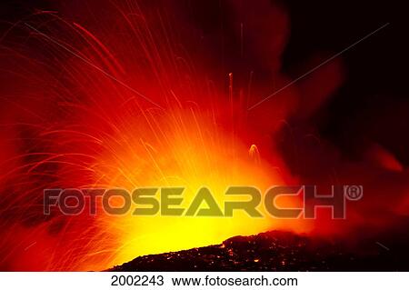 Stock Image - Hawaii, Big Island, Hawaii Volcanoes National Park, Lava Exploding Into Ocean At Night, Red And Orange Steam. Fotosearch