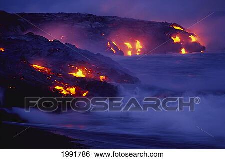 Stock Photograph - Hawaii, Big Island, Hawaii Volcanoes National Park, Lava Flows Into Ocean At Night, Creating A Purple Mist.. Fotosearch