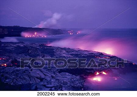Stock Photography - Hawaii, Big Island, Hawaii Volcanoes National Park, Lava Flows Into Ocean, Pink Hues Along Coastline. Fotosearch