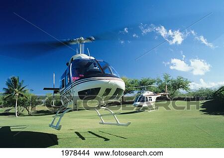 Picture - Hawaii, Big Island, Helicopter Mauna Lani Bay Taking Off.. Fotosearch