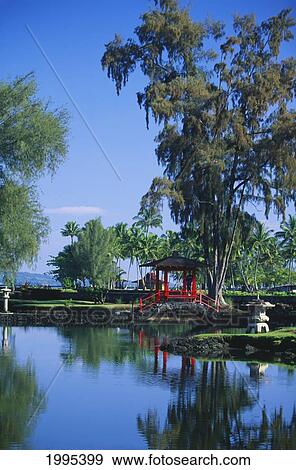 Stock Photo - Hawaii, Big Island, Hilo, Liliuokalani Gardens. Red Pagoda Bridge Over Water.. Fotosearch