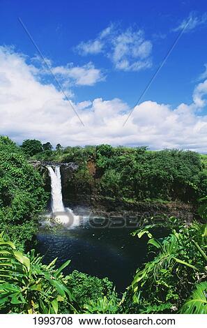 Stock Photo - Hawaii, Big Island, Hilo, Wailuku River State Park, Rainbow Falls, Rainbow In Mist Of Waterfall.. Fotosearch