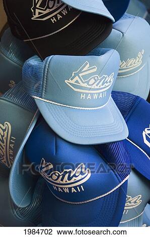 Stock Image - Hawaii, Big Island, Kailua-Kona, Hats With Kona, Hawaii Printed On Them In A Store On Ali'i Drive.. Fotosearch